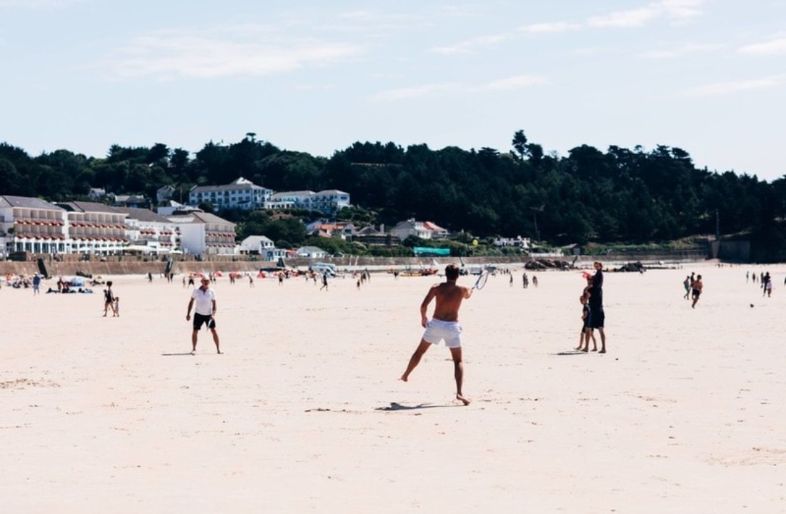 people playing on the beach